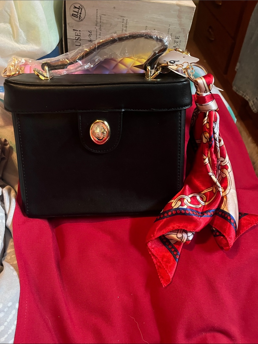 Black Structured Mini Top-Handle Bag with Red Scarf Accent